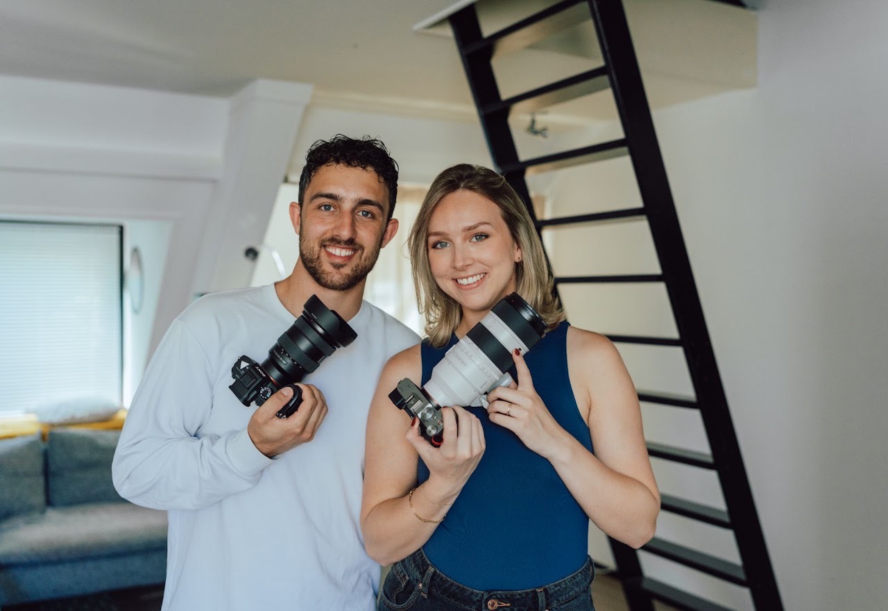 Pien and Liam of Side Dish Studio holding cameras